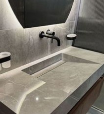 Installed wonderful lighting in this bathroom along with marble countertop